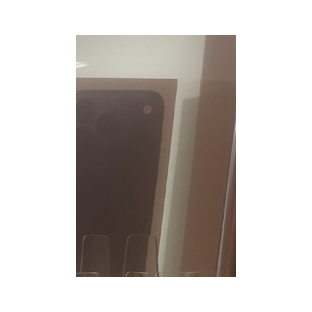 Actual CambTech shop display photo of iPhone 17promax; reflections visible